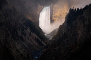 Lower Falls at the Grand Canyon of the Yellowstone being spotlit at Yellowstone National Park