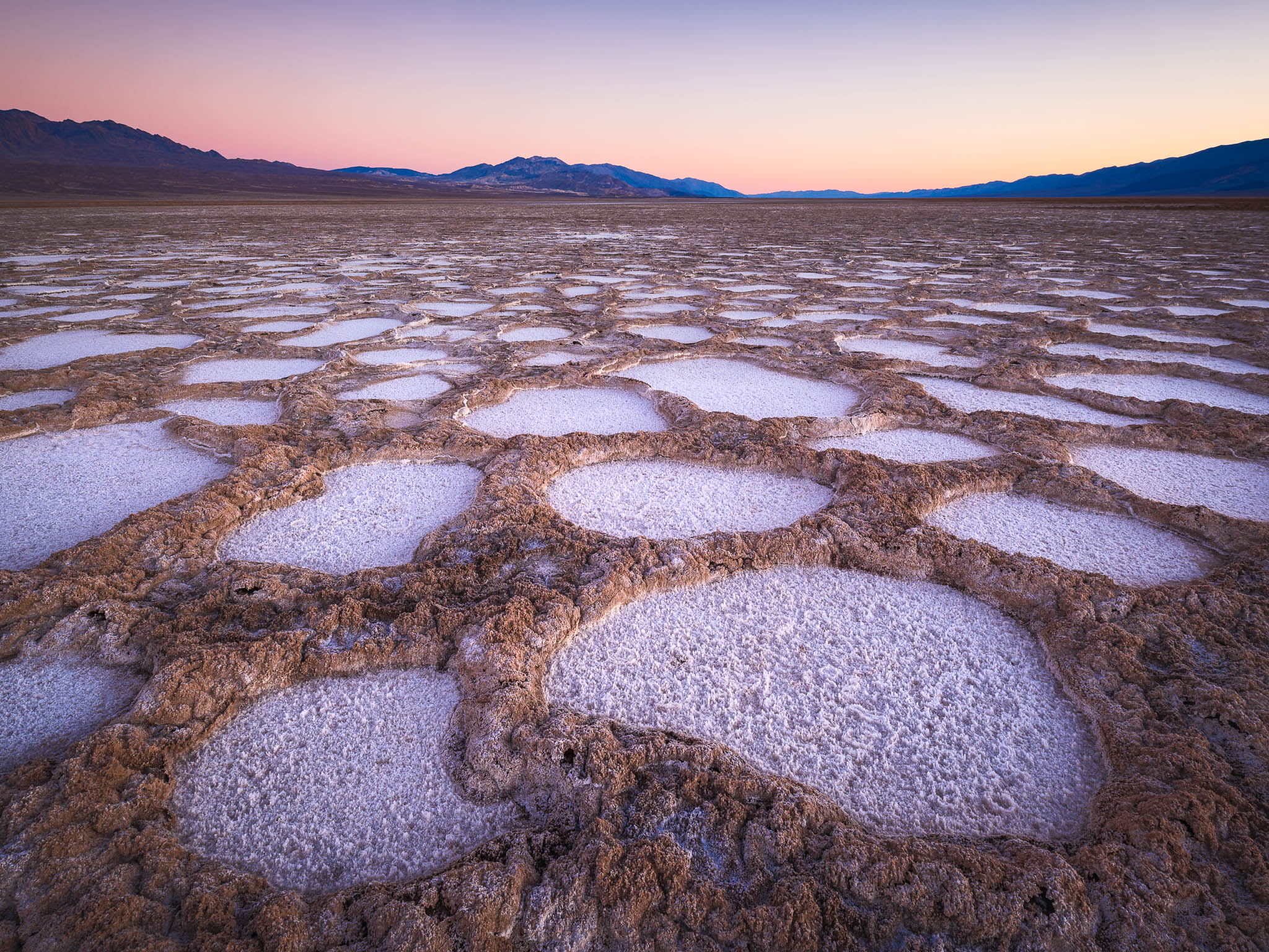 twilight glow after sunset on cottonball basin in death valley national park