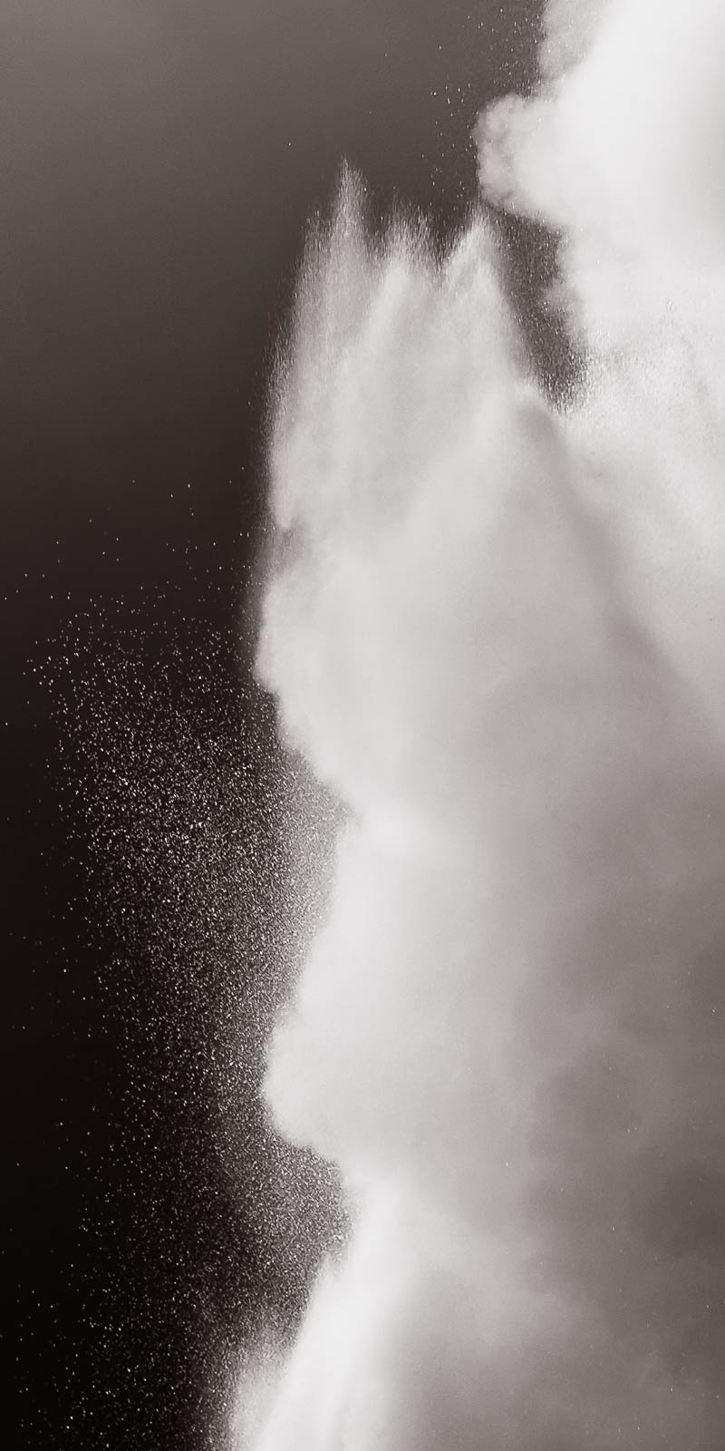 Spray Erupting water from geyser in Yellowstone National Park